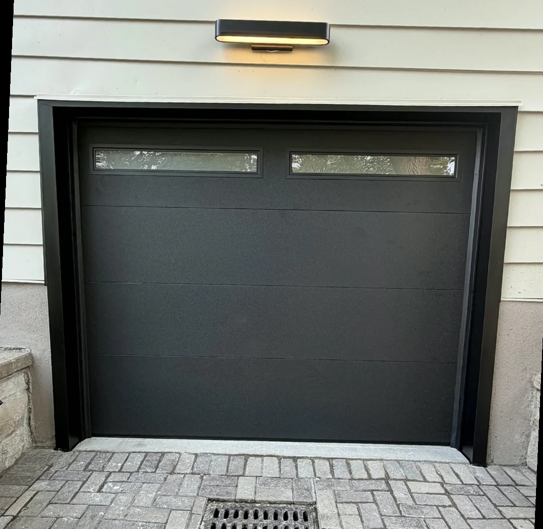 Garage door frame after aluminum capping by Liftime Ottawa — clean white aluminum trim