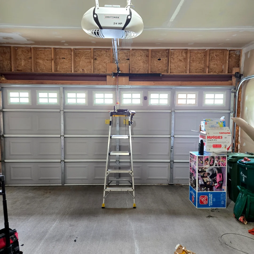 The same Ottawa garage door restored to operation with new spring, balanced, and a fresh Craftsman opener installed by Liftime