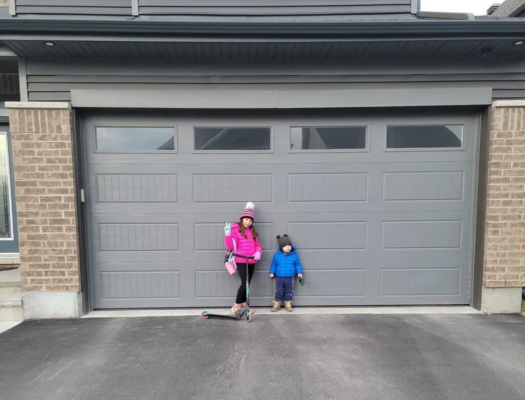Modern Ottawa home with a freshly installed R-16 insulated grey garage door