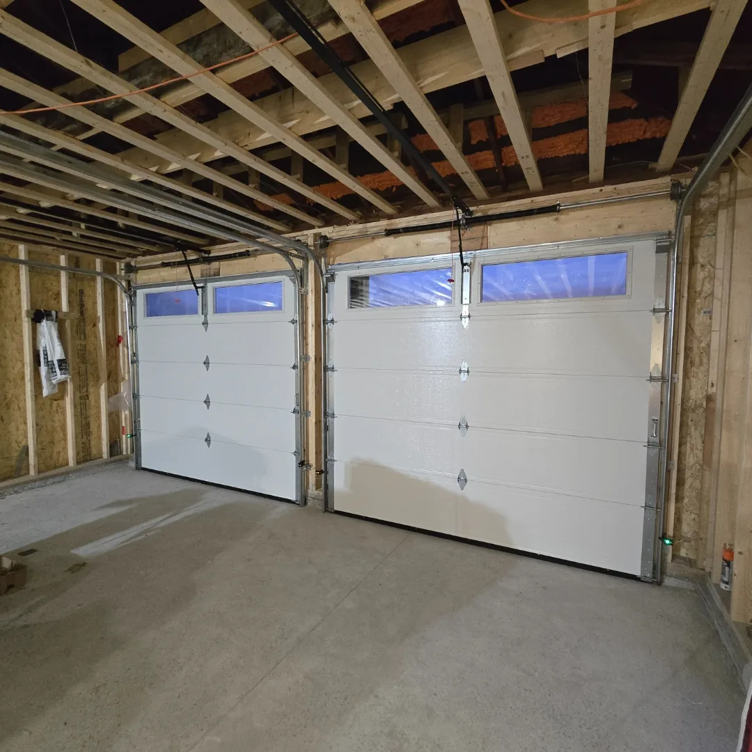 Dark brown raised-panel garage door on brick Ottawa home, installed by Liftime