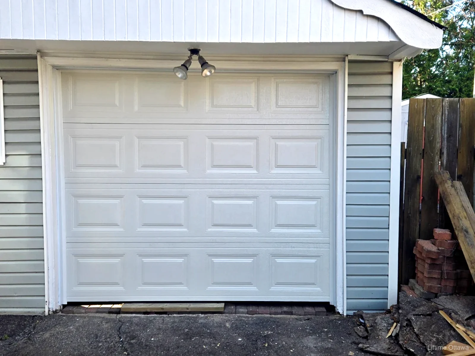 TOHO Classic 300 white garage door installed by Liftime on an Ottawa back-lane garage