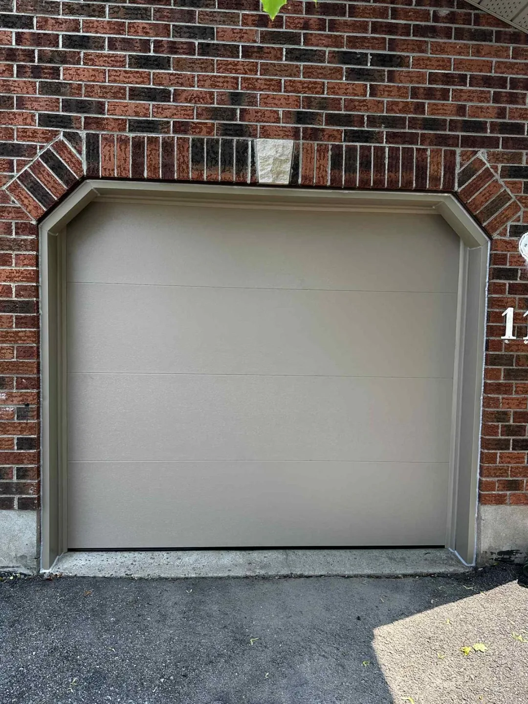 TOHO Flash 800 sandstone garage door with aluminum capping, installed by Liftime Ottawa
