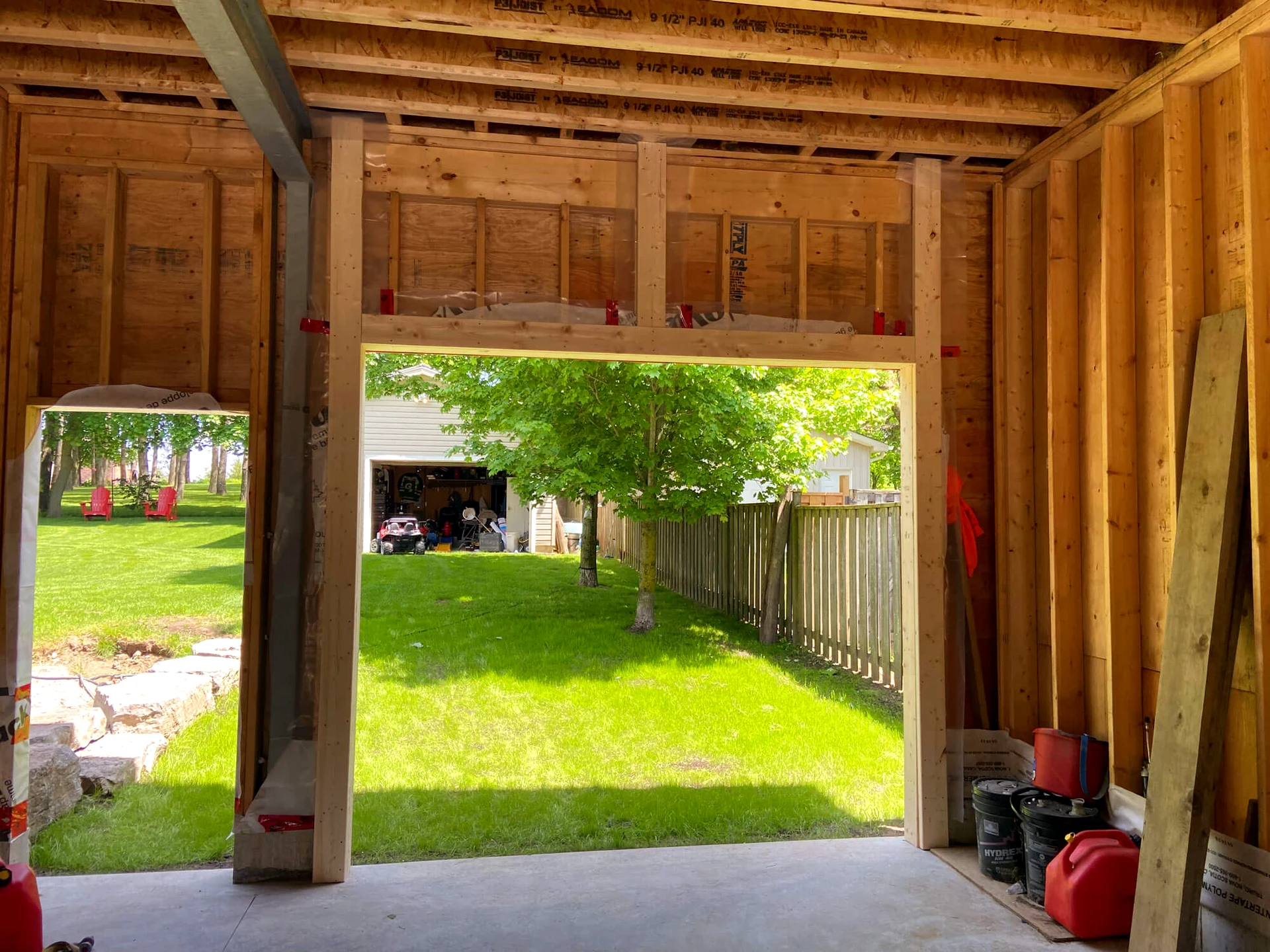 Rotted garage door wood jamb being replaced with pressure-treated lumber by Liftime in Ottawa