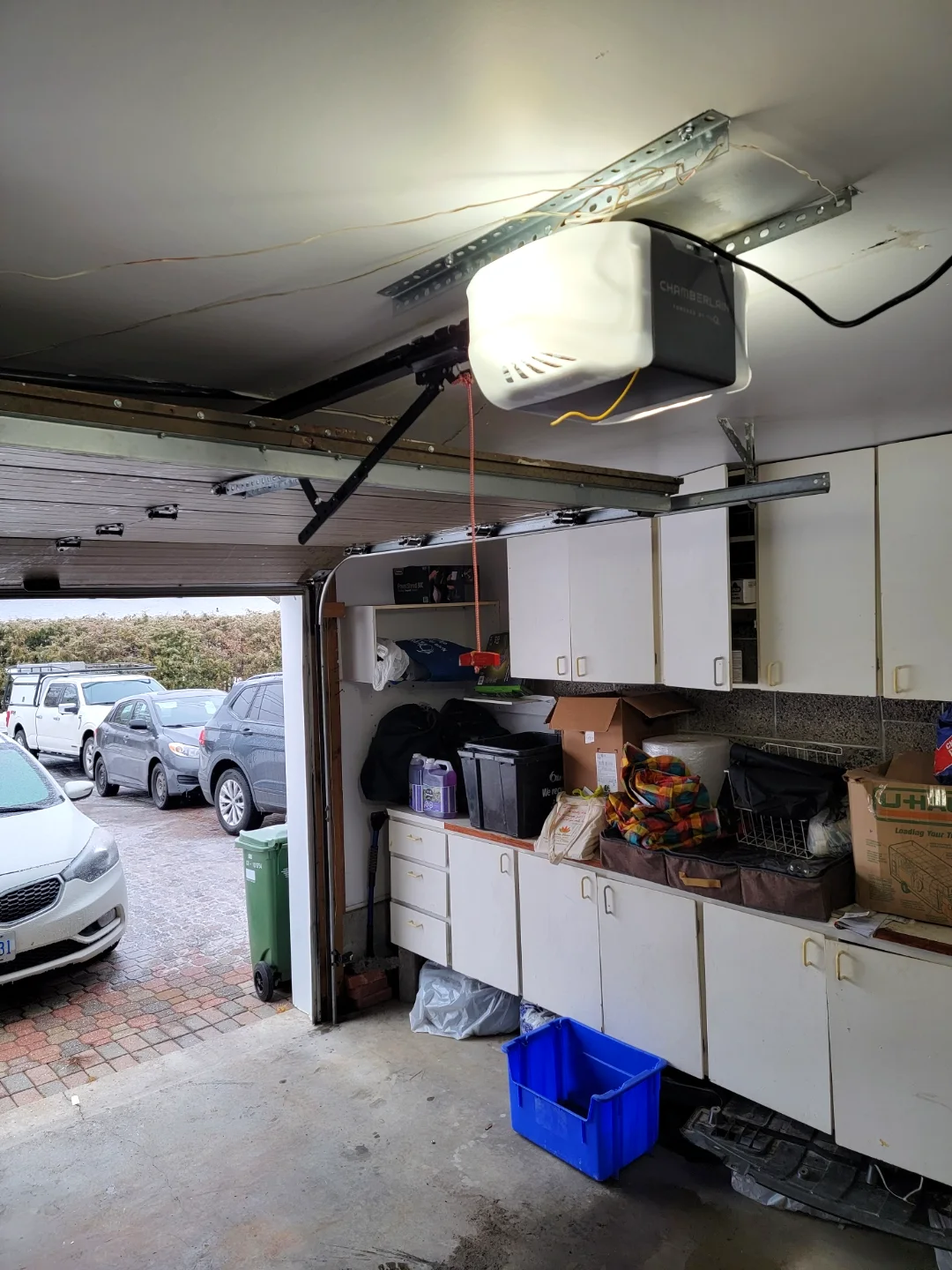 Chamberlain belt-drive garage door opener freshly mounted to a ceiling rail in an Ottawa garage by Liftime