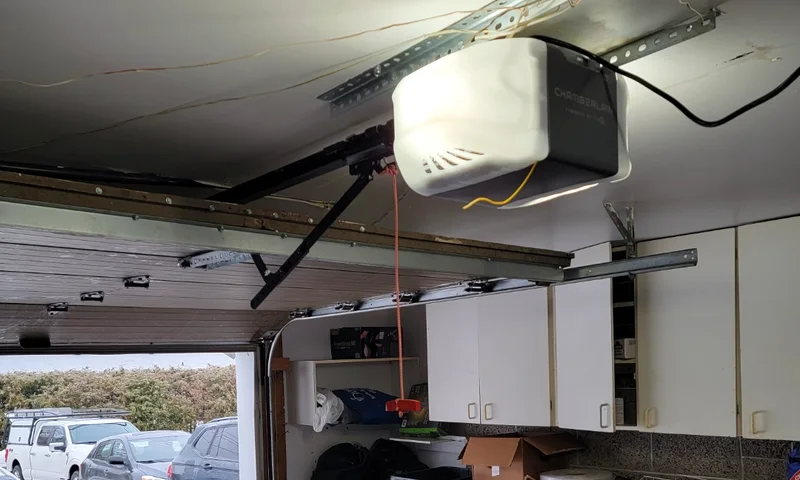 Brand-new Chamberlain belt-drive garage door opener mounted to the ceiling rail in an Ottawa garage by Liftime