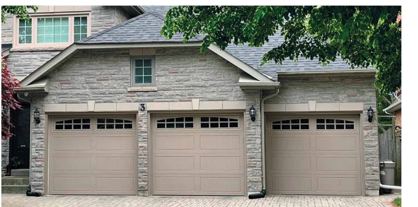 TOHO Carriage 600 garage door — true arched-window carriage style with decorative trim