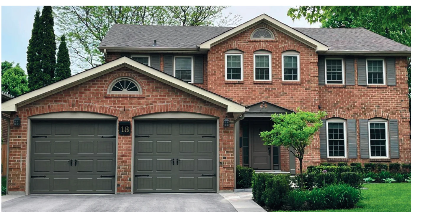 TOHO Coach House 400 garage door — carriage-style with tall narrow top-row windows